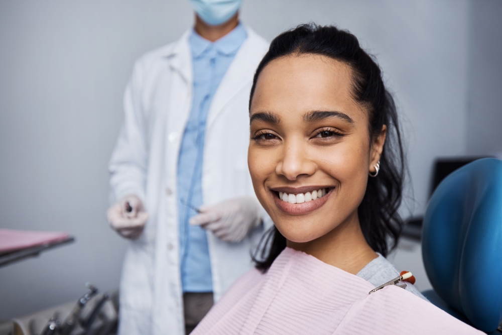 Oral health checkup, woman smiling with white teeth, dentist behind her